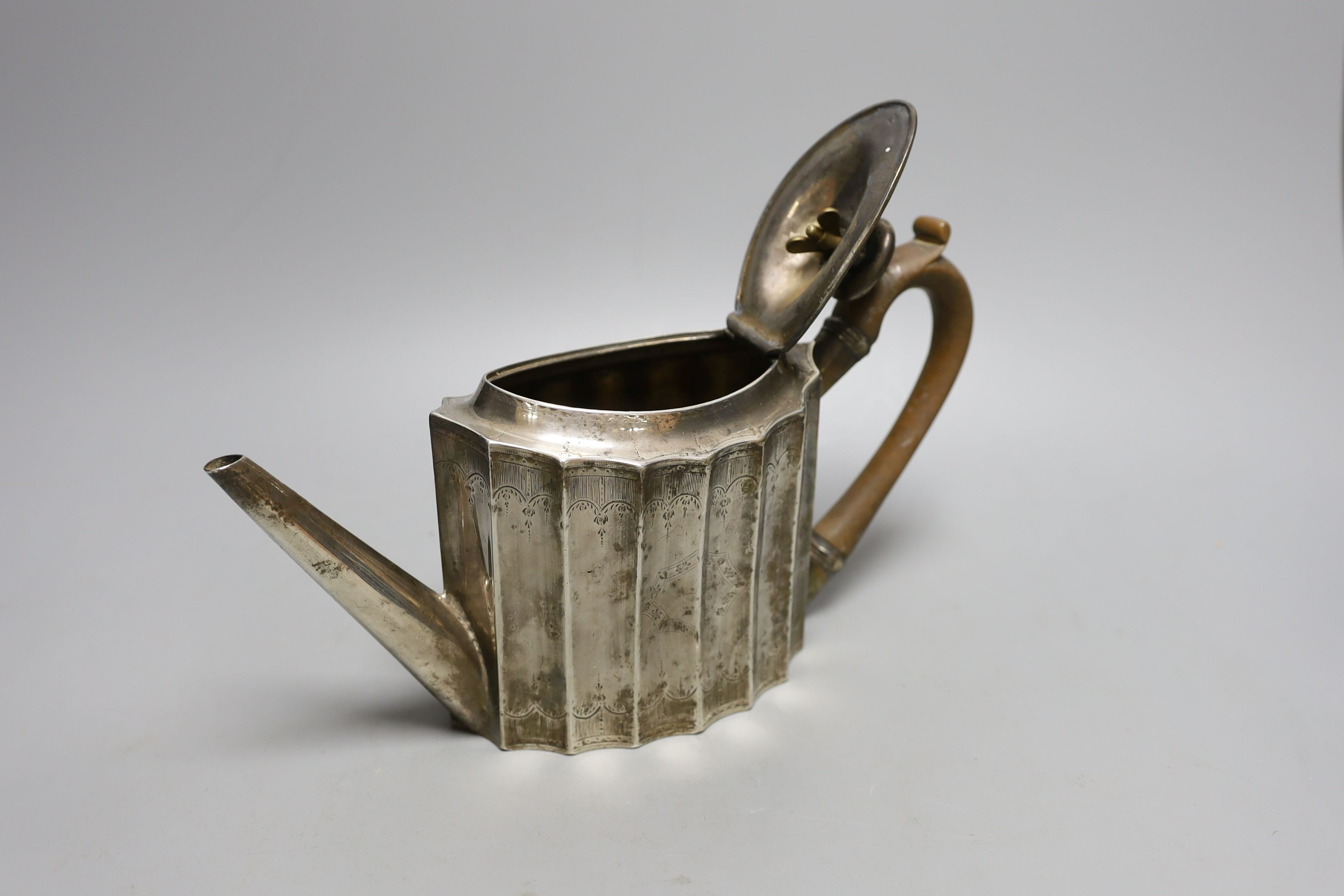 A George III engraved silver oval 'batwing' shaped teapot, George Smith II, London, 1788, gross weight 14.5oz.